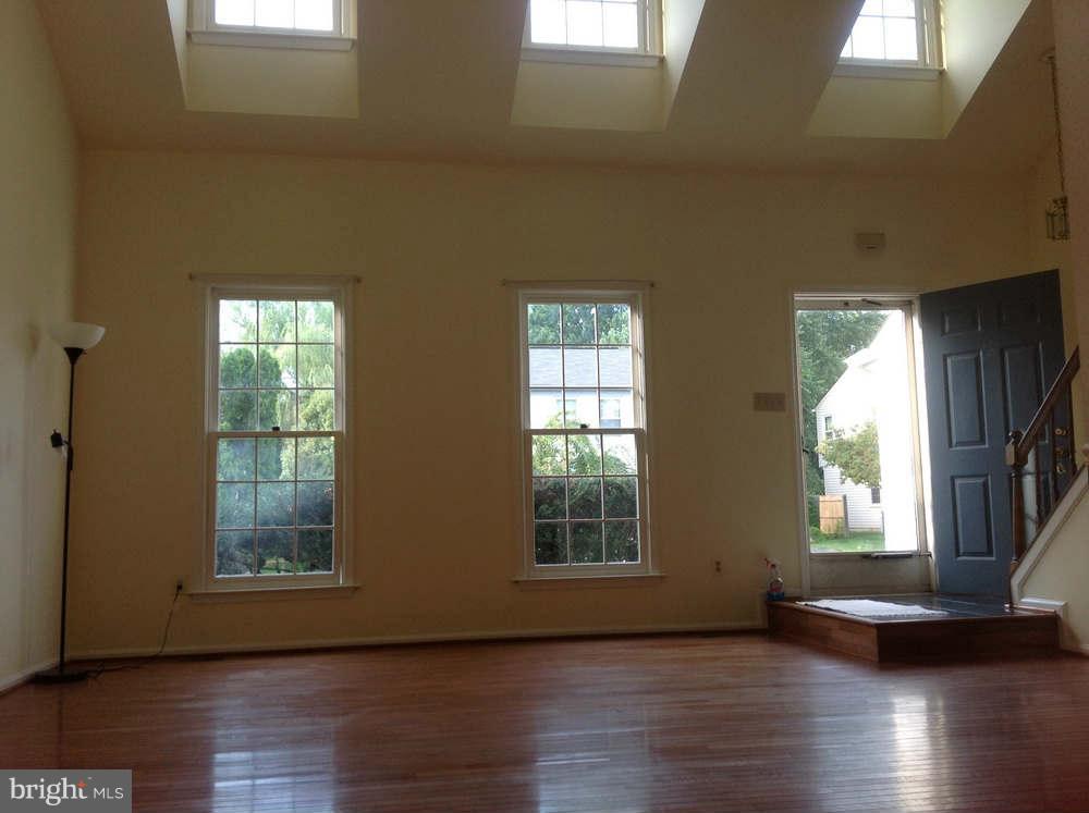 11624 Bootjack Court North Potomac, MD 20878 - Photo 8 of 15 a view of an empty room with wooden floor and a window