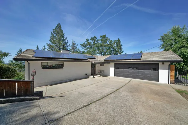 a front view of a house with a garage