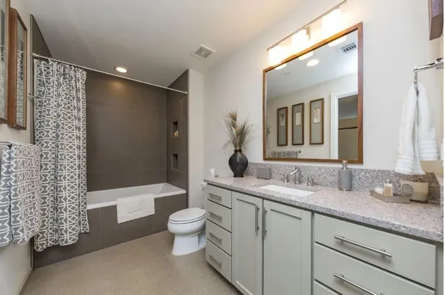 a bathroom with a shower and a bathtub