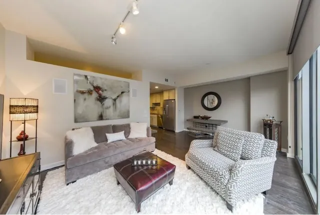 a living room with furniture and a table