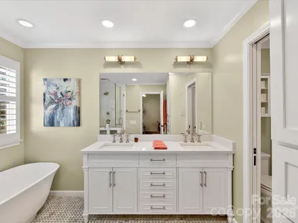 a bathroom with a double vanity sink mirror and double