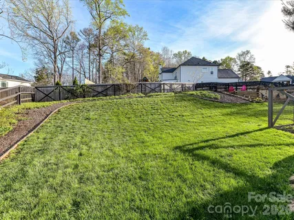 a view of a garden with houses