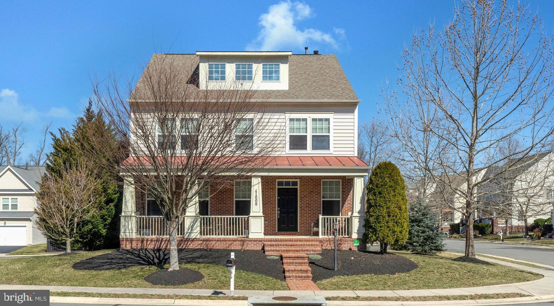 41008 Indigo Place Leesburg, VA 20175 - Photo 1 of 59 a front view of a house with a yard