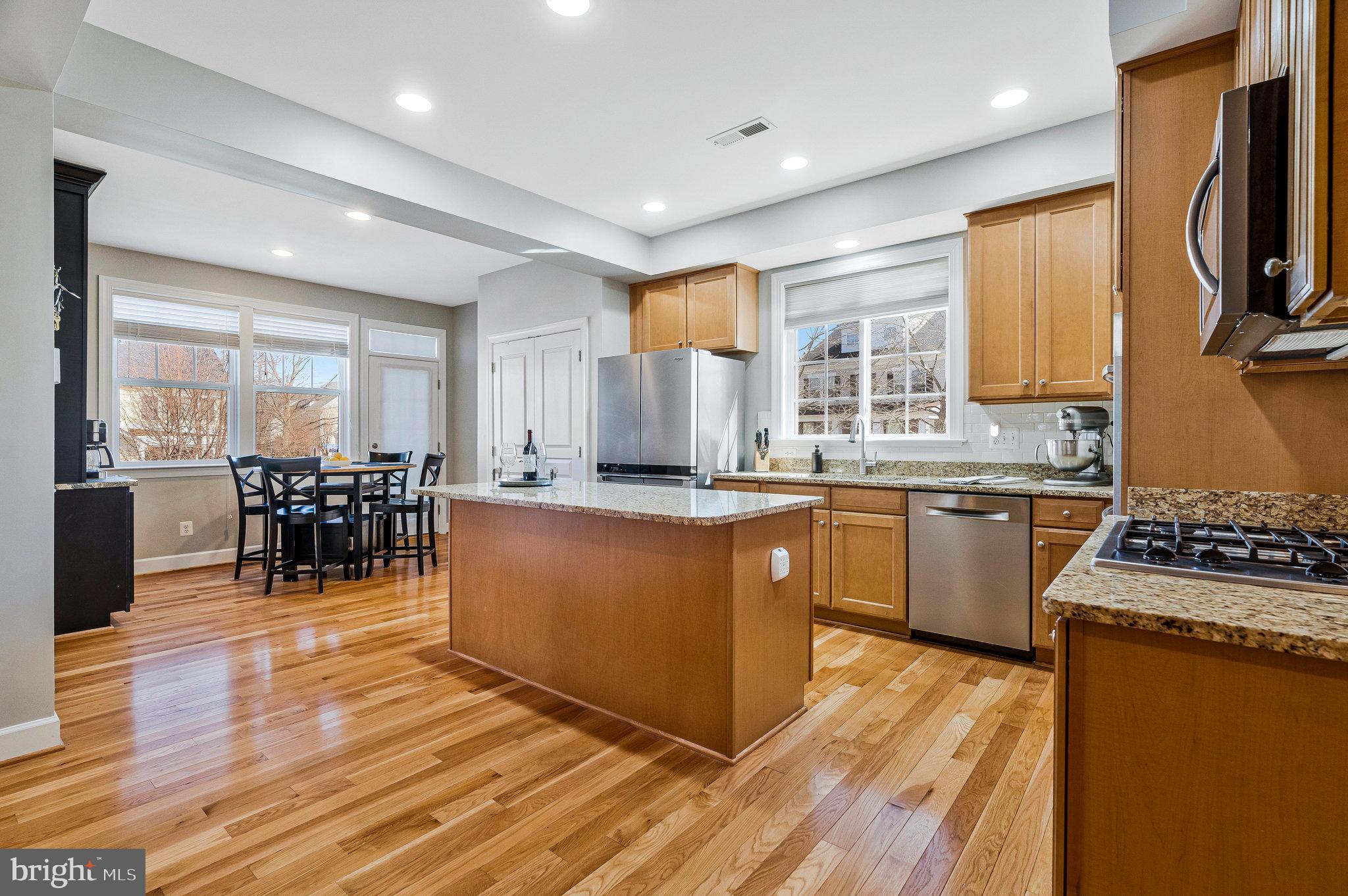 41008 Indigo Place Leesburg, VA 20175 - Photo 13 of 59 a kitchen with counter top space a sink and appliances