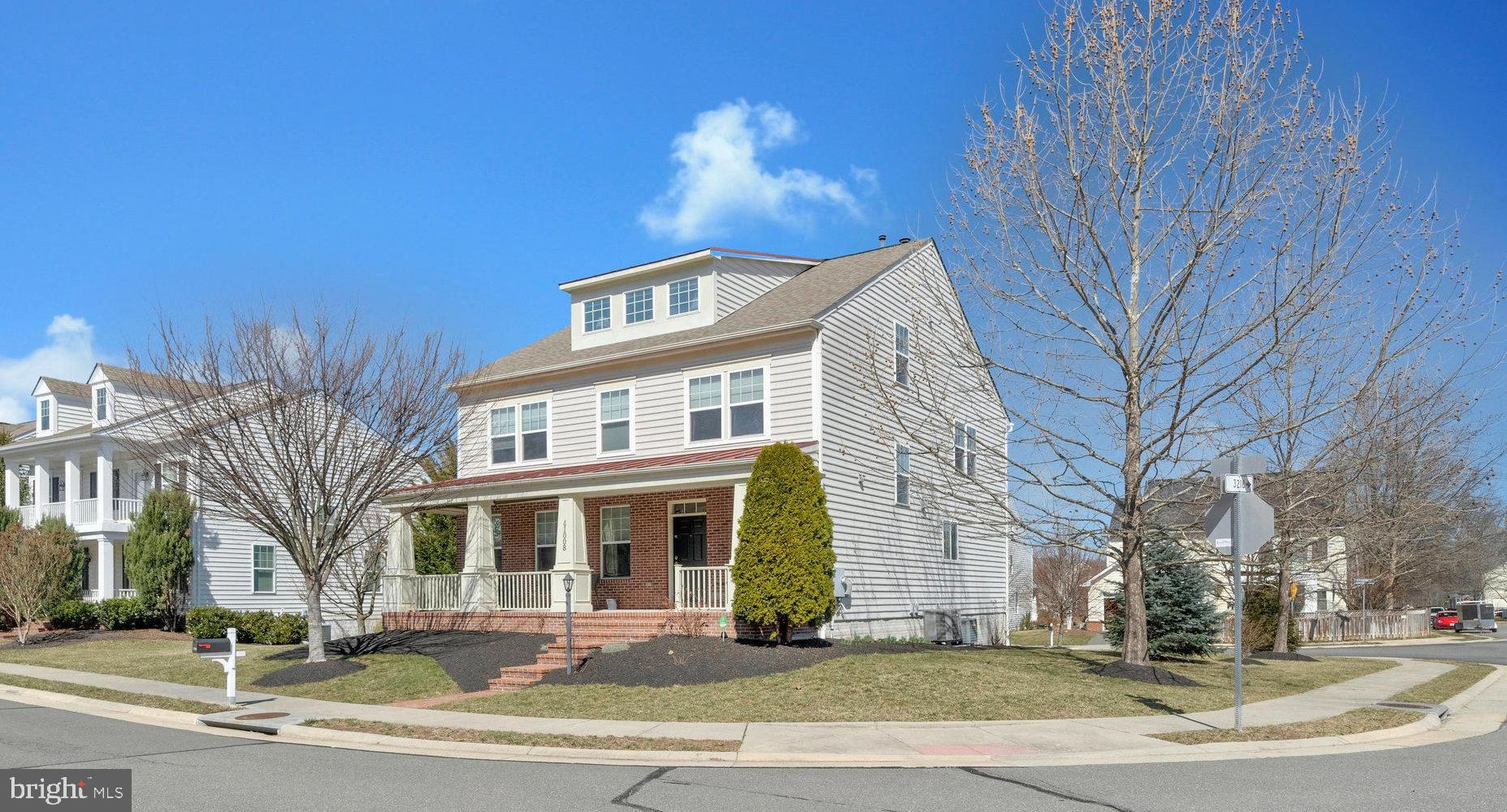 41008 Indigo Place Leesburg, VA 20175 - Photo 2 of 59 a front view of a house with a yard