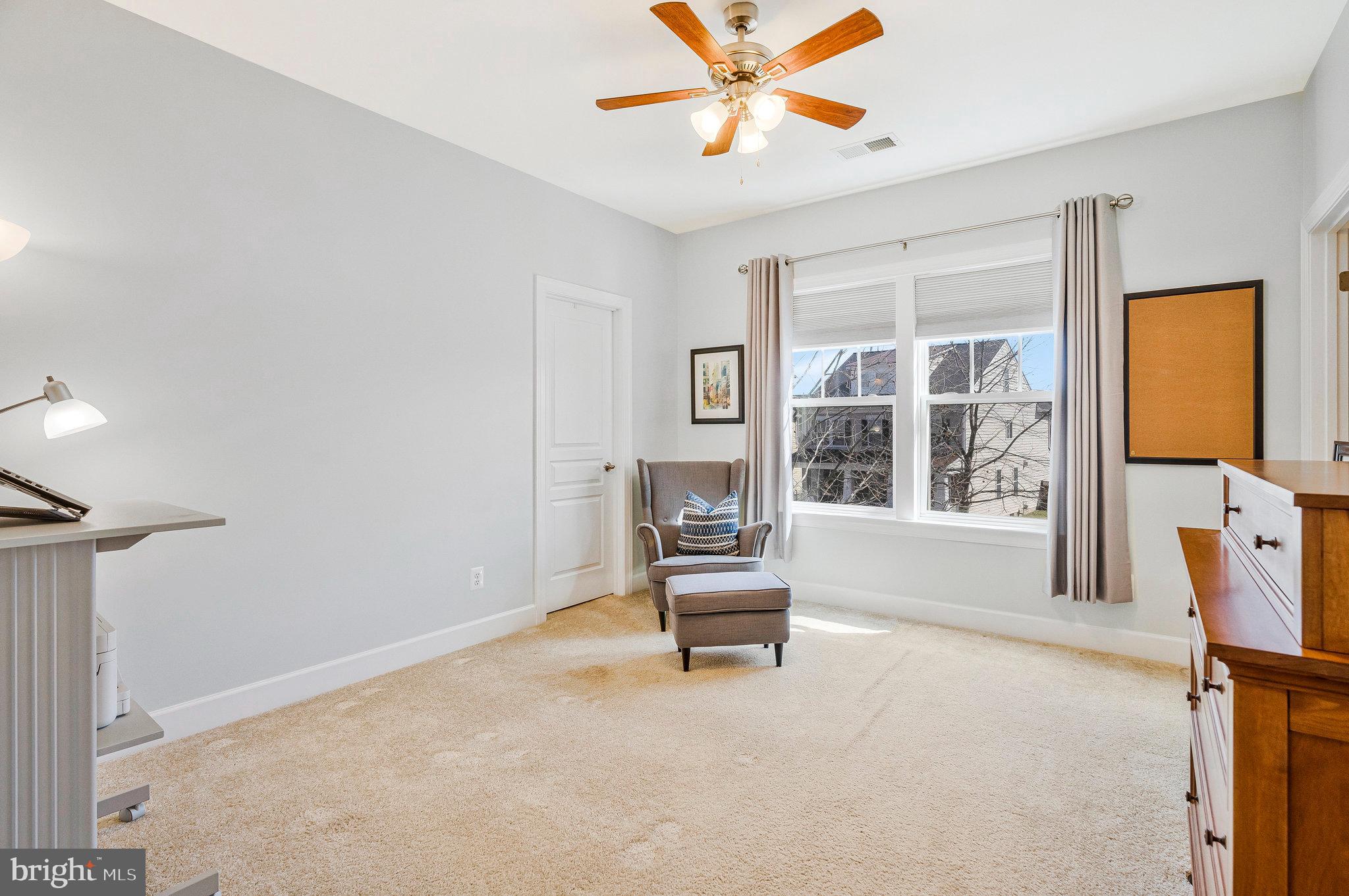 41008 Indigo Place Leesburg, VA 20175 - Photo 35 of 59 a living room with furniture and a window