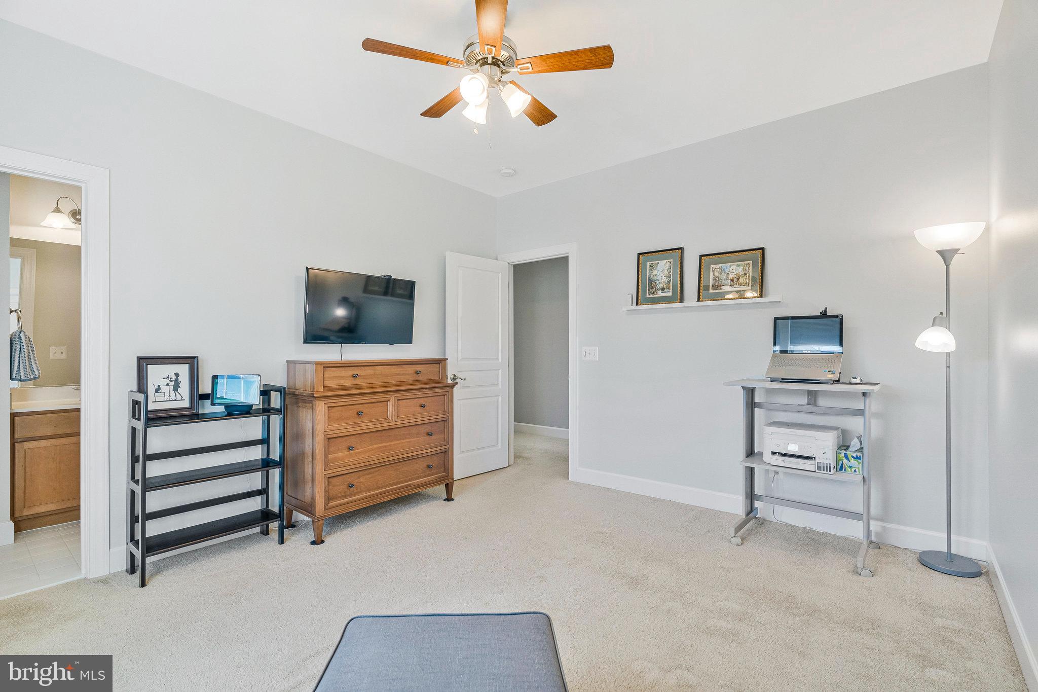 41008 Indigo Place Leesburg, VA 20175 - Photo 36 of 59 a view of room with furniture and a ceiling fan