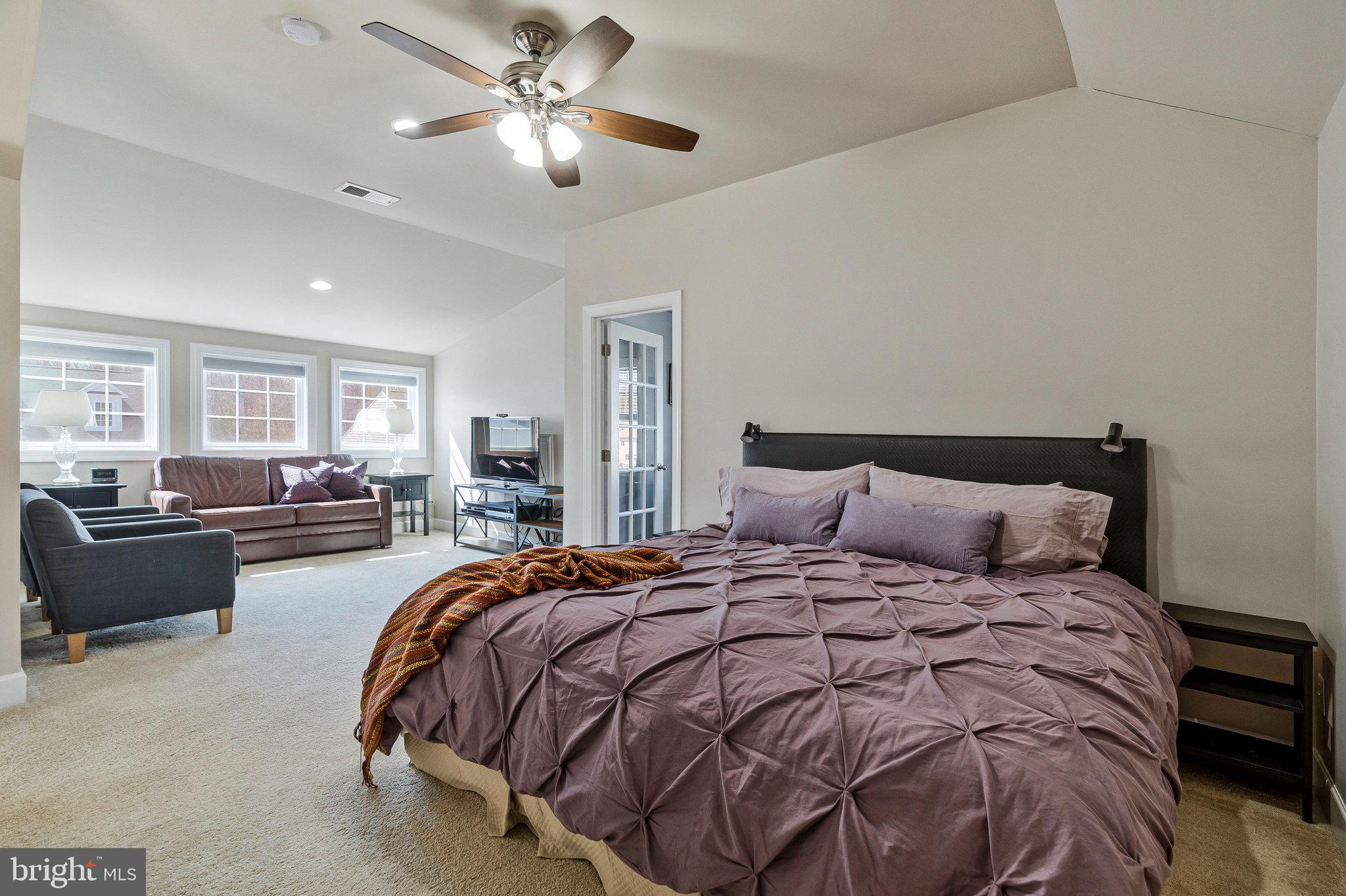 41008 Indigo Place Leesburg, VA 20175 - Photo 39 of 59 a bedroom with bed and a chandelier