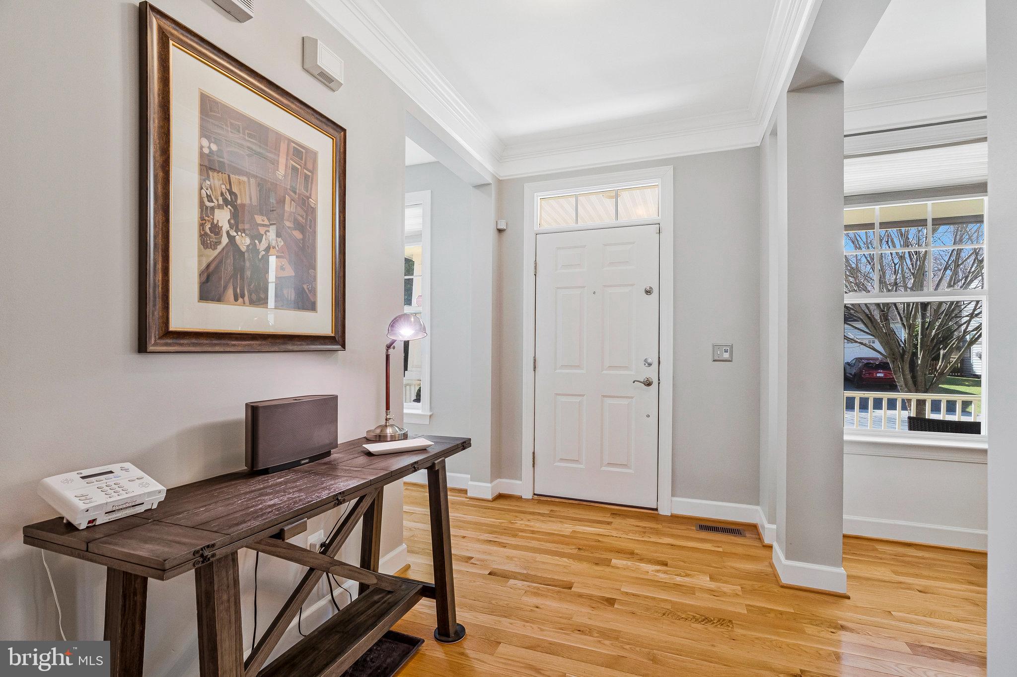 41008 Indigo Place Leesburg, VA 20175 - Photo 4 of 59 a view of a workspace with furniture and wooden floor