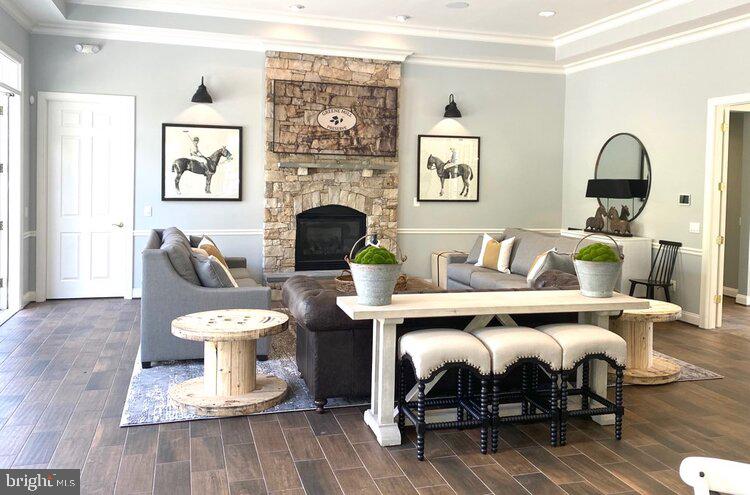 41008 Indigo Place Leesburg, VA 20175 - Photo 55 of 59 a living room with furniture and a wooden floor