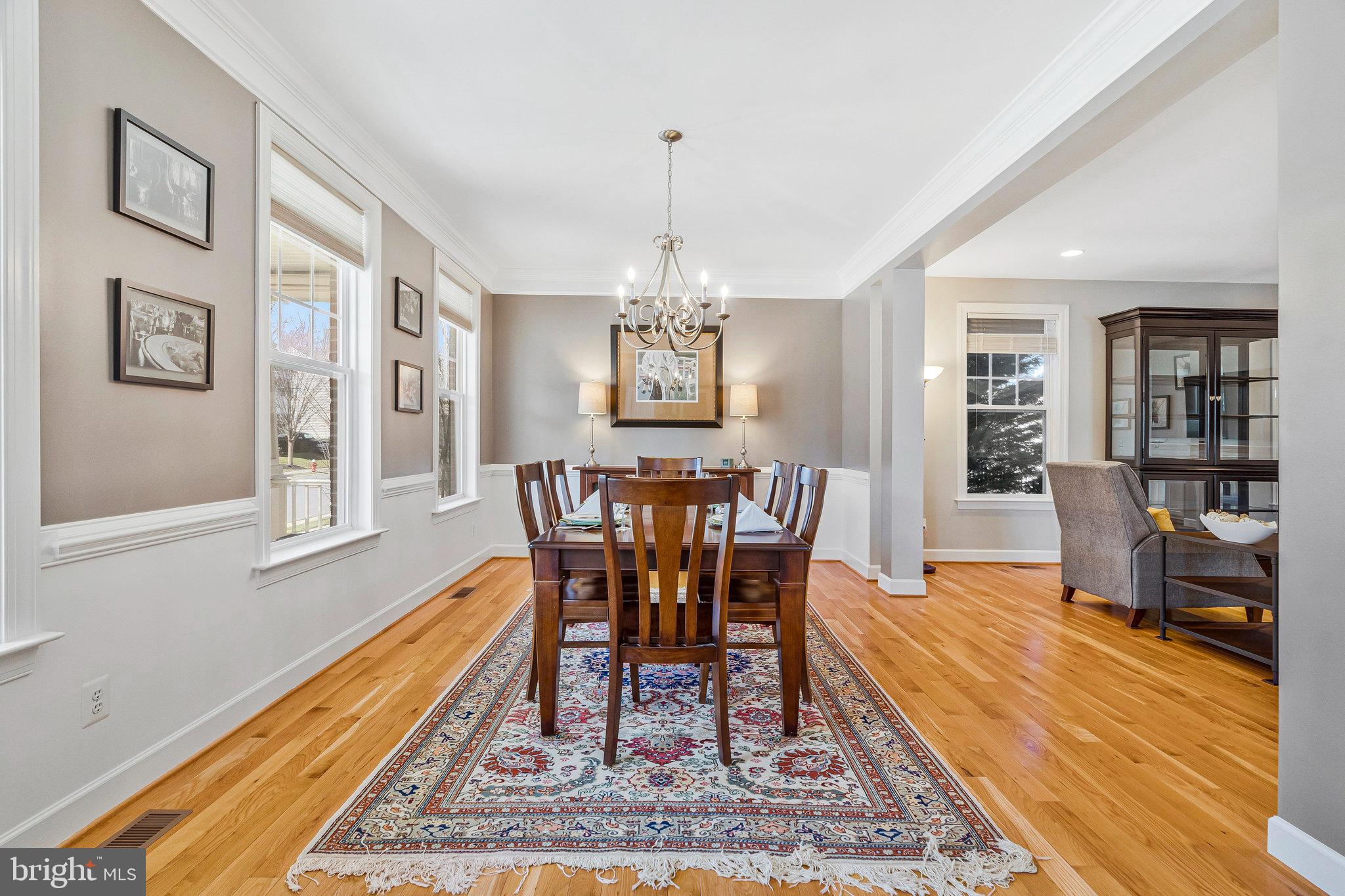41008 Indigo Place Leesburg, VA 20175 - Photo 6 of 59 a view of a dining room with furniture window and wooden floor