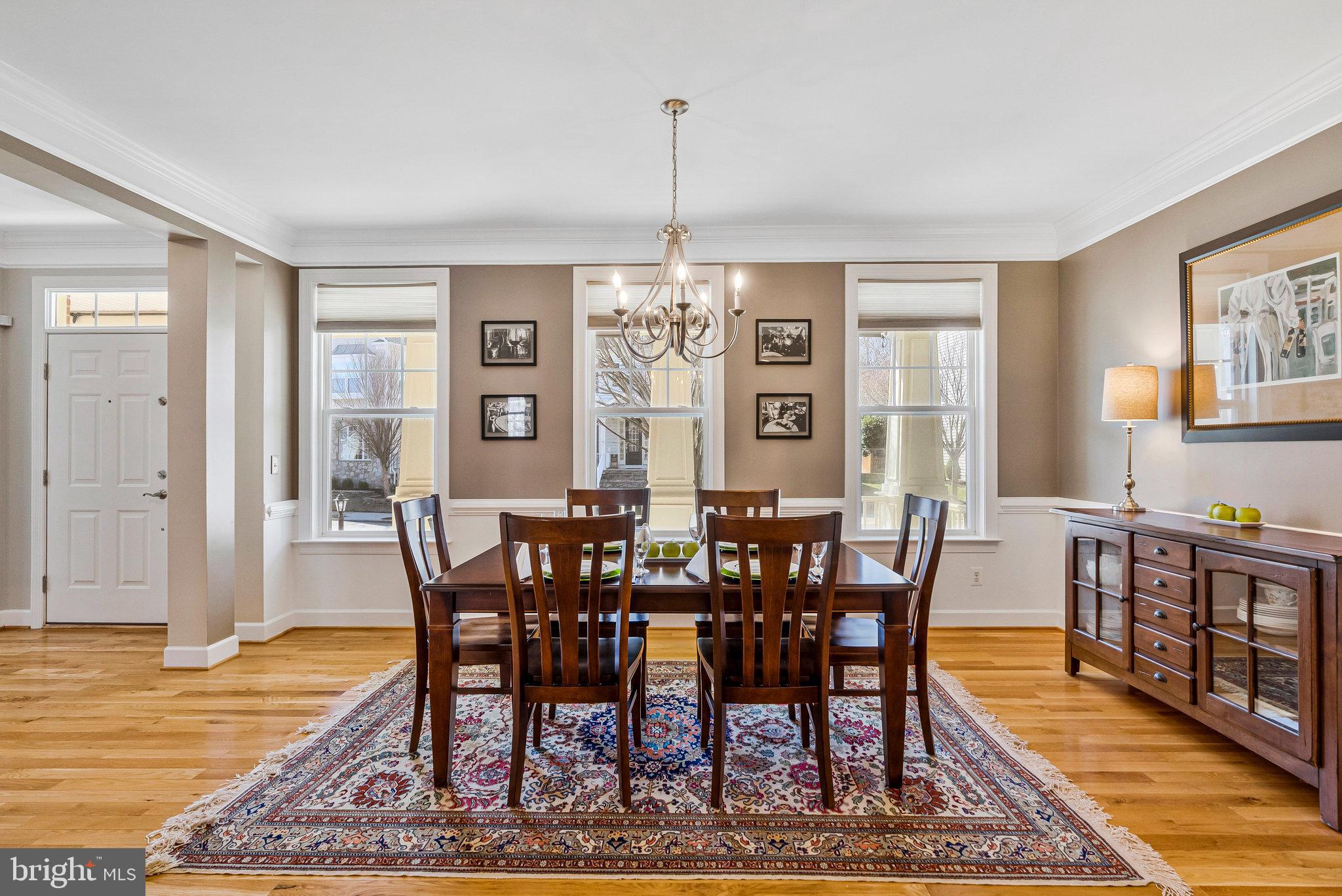 41008 Indigo Place Leesburg, VA 20175 - Photo 9 of 59 a view of a dining room with furniture window and wooden floor