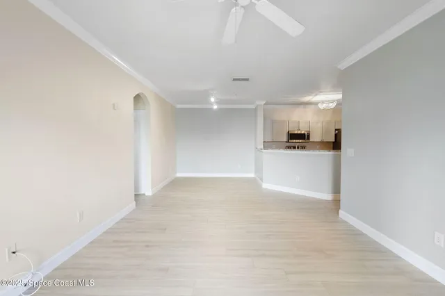 a view of an empty room with a bathroom