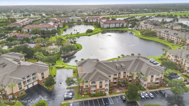 a front view of a residential apartment building with a yard