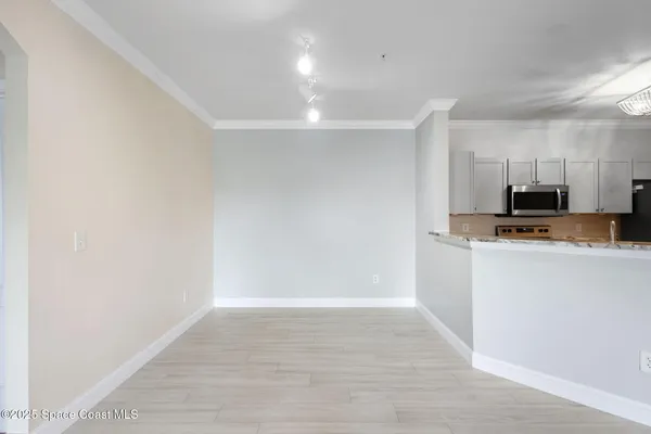 a view of a kitchen and a window