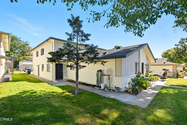 a front view of house with yard and seating area