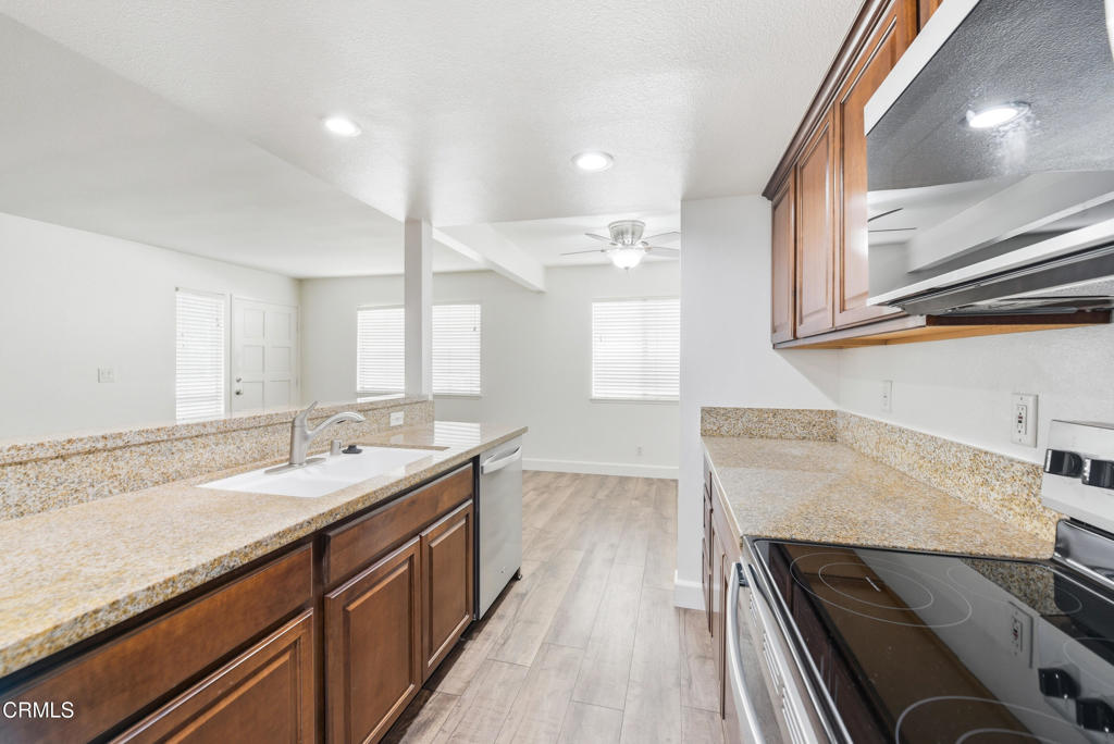 1210 Carlsbad Place Ventura, CA 93003 - Photo 11 of 22 a kitchen with a sink stove and cabinets