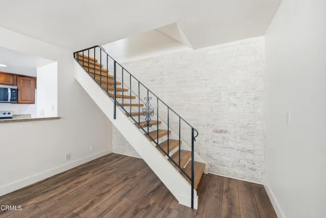 a view of entryway with wooden floor