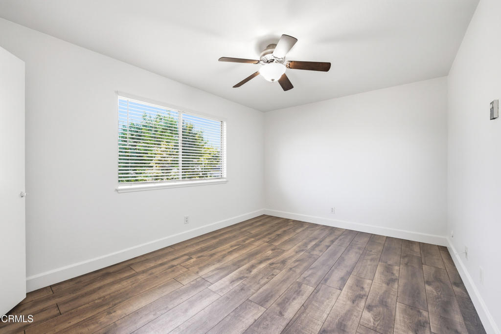 1210 Carlsbad Place Ventura, CA 93003 - Photo 17 of 22 wooden floor in an empty room with a window