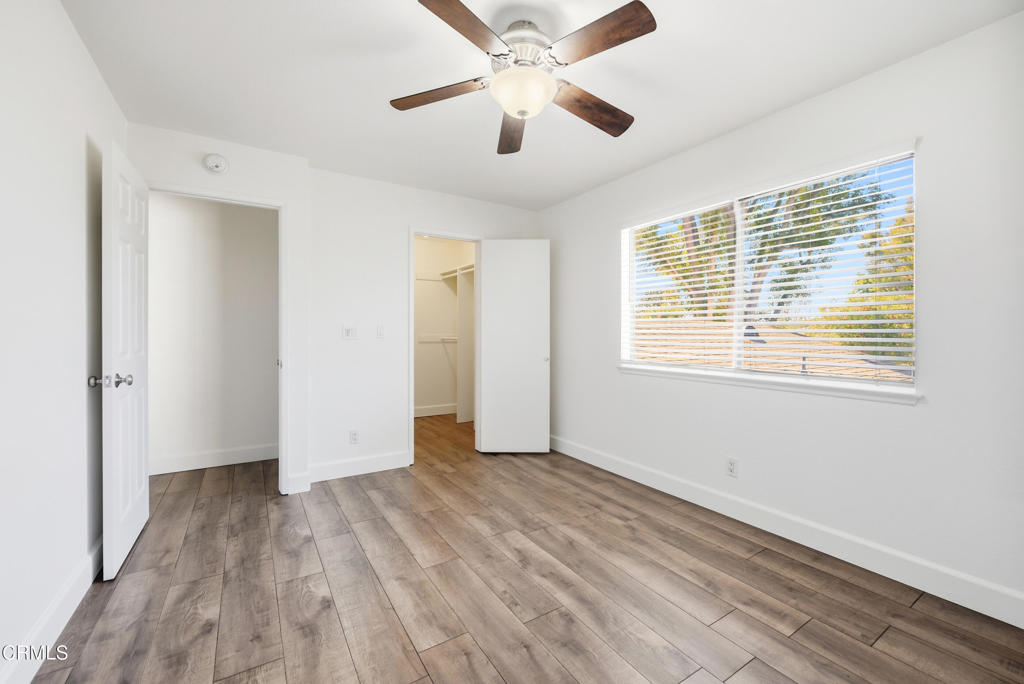 1210 Carlsbad Place Ventura, CA 93003 - Photo 18 of 22 a view of an empty room with wooden floor and a window