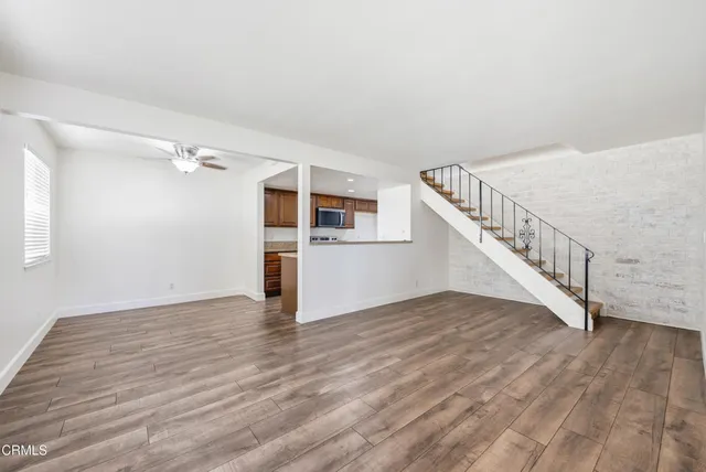 a view of an entryway with wooden floor