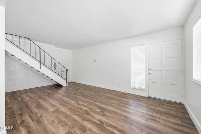 a view of an entryway with wooden floor