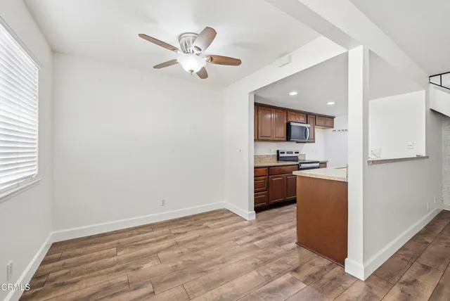 a kitchen with a refrigerator a stove top oven a sink and dishwasher