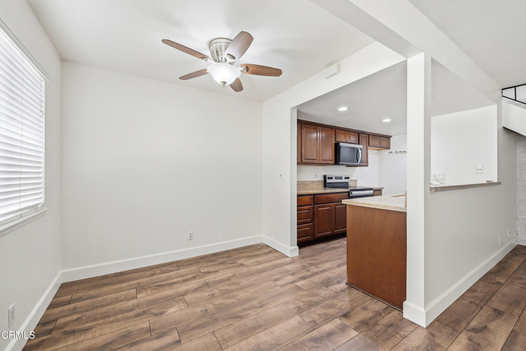 1210 Carlsbad Place Ventura, CA 93003 - Photo 7 of 22 a kitchen with a refrigerator a stove top oven a sink and dishwasher