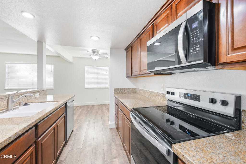 1210 Carlsbad Place Ventura, CA 93003 - Photo 10 of 22 a kitchen with a stove oven and a sink