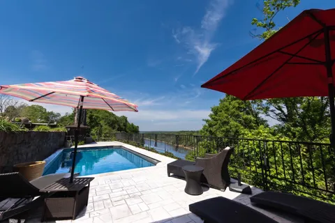 a view of a swimming pool with a patio