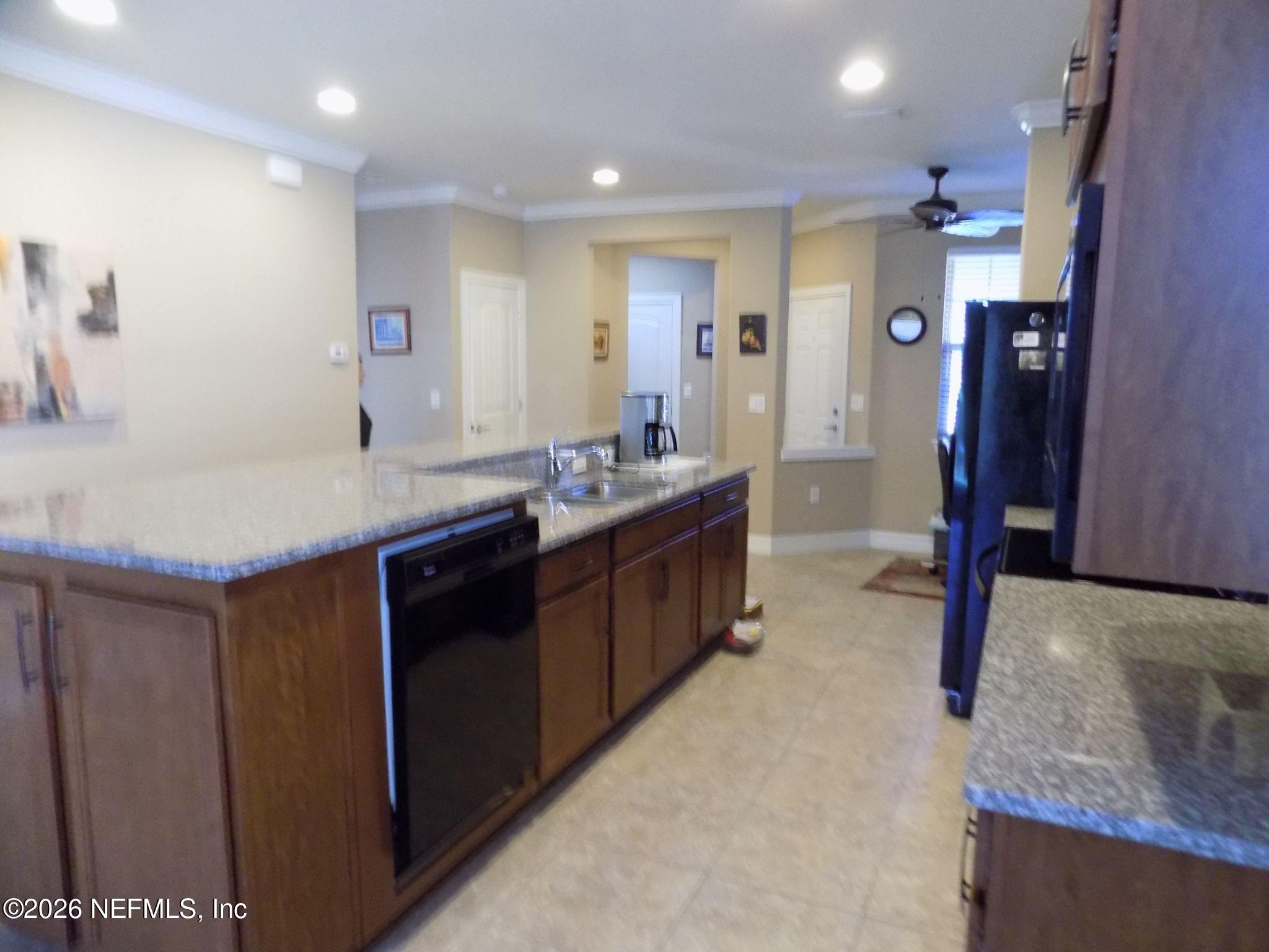 144 Goldenrod Park Road Ponte Vedra, FL 32081 - Photo 15 of 40 a bathroom with a granite countertop sink a mirror and a shower