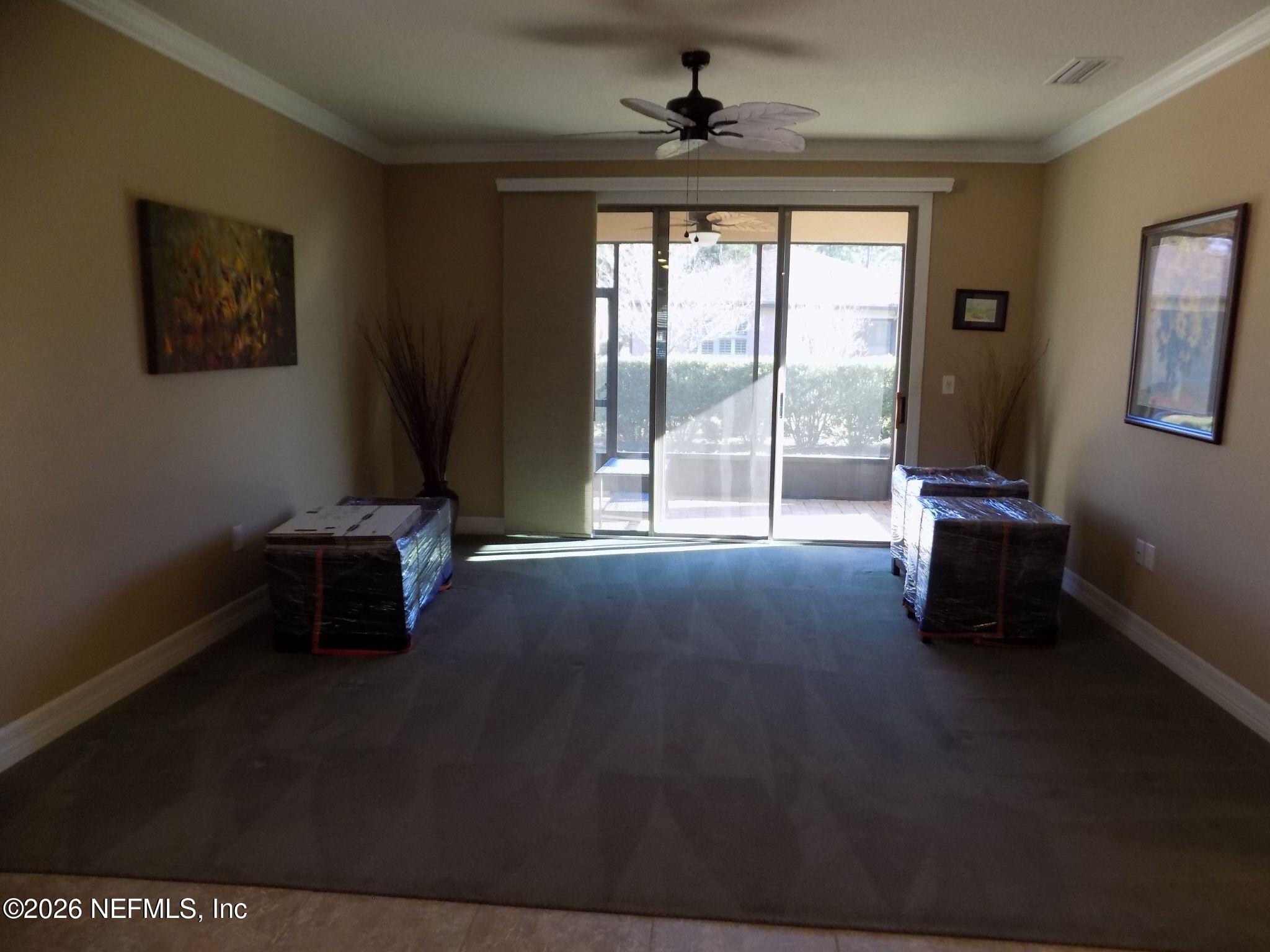 144 Goldenrod Park Road Ponte Vedra, FL 32081 - Photo 17 of 40 a living room with a large window