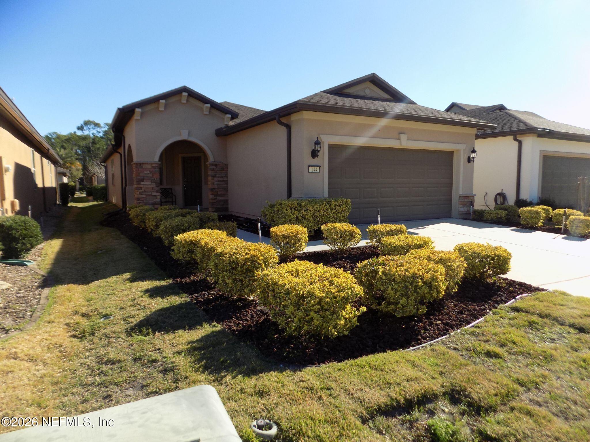 144 Goldenrod Park Road Ponte Vedra, FL 32081 - Photo 2 of 40 a front view of a house with a yard