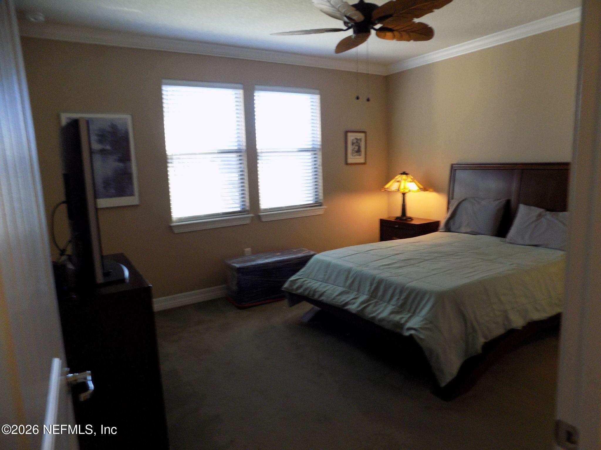 144 Goldenrod Park Road Ponte Vedra, FL 32081 - Photo 21 of 40 a bedroom with a bed and a window