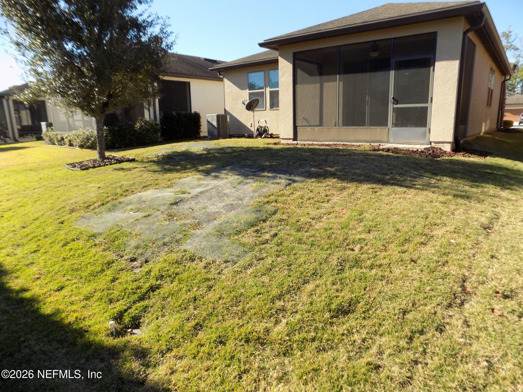 144 Goldenrod Park Road Ponte Vedra, FL 32081 - Photo 37 of 40 a front view of a house with a yard