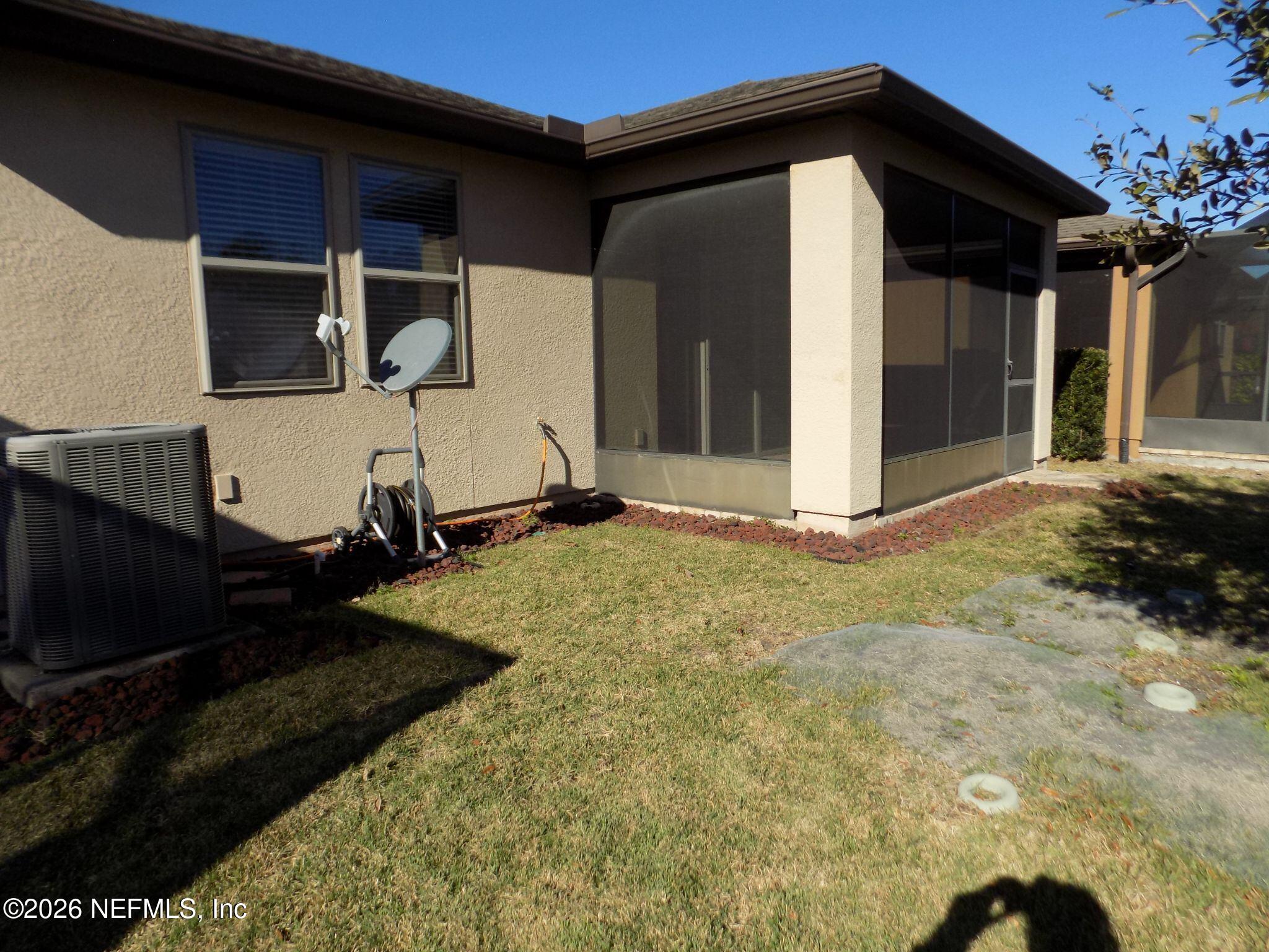 144 Goldenrod Park Road Ponte Vedra, FL 32081 - Photo 39 of 40 a view of a house with a yard