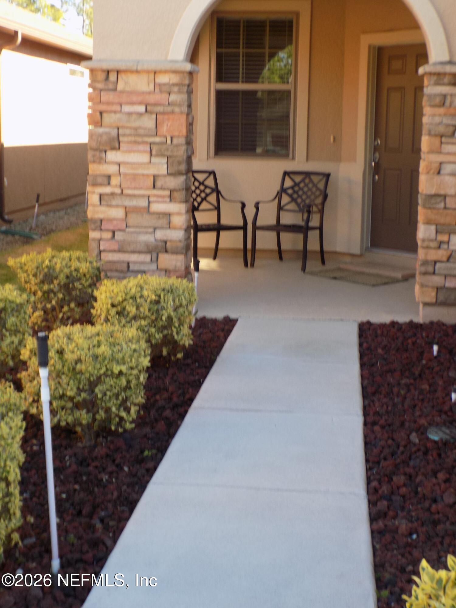 144 Goldenrod Park Road Ponte Vedra, FL 32081 - Photo 6 of 40 a view of a chairs and table in the patio