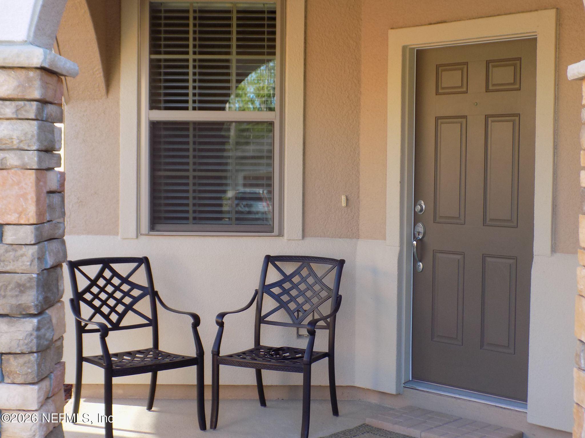 144 Goldenrod Park Road Ponte Vedra, FL 32081 - Photo 7 of 40 a view of chair and table in a room