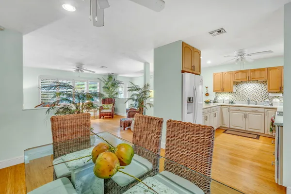 a bathroom with a granite countertop toilet sink and mirror