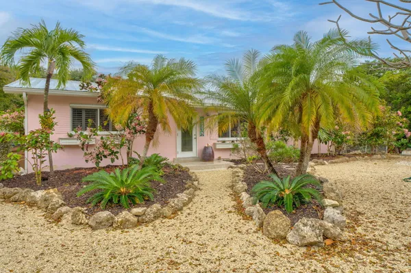 a front view of a house with a garage