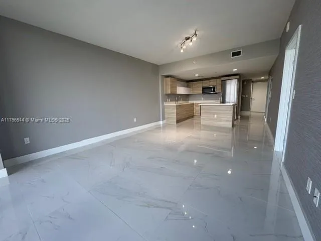 a kitchen with stainless steel appliances granite countertop a sink and a stove