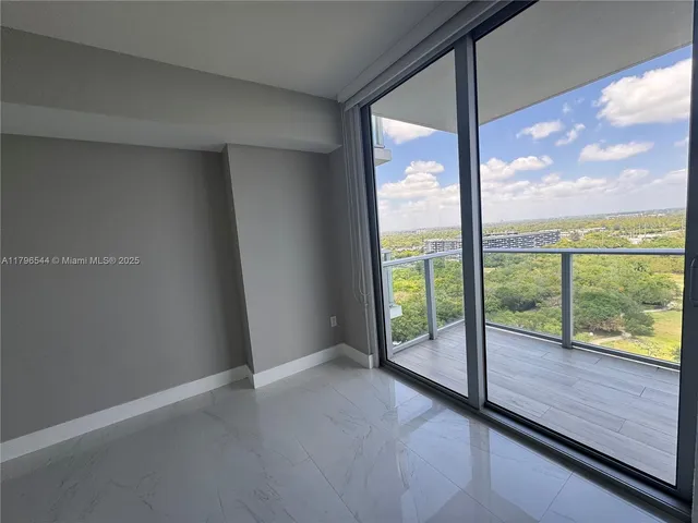 a spacious bathroom with a double vanity sink a large mirror and a shower