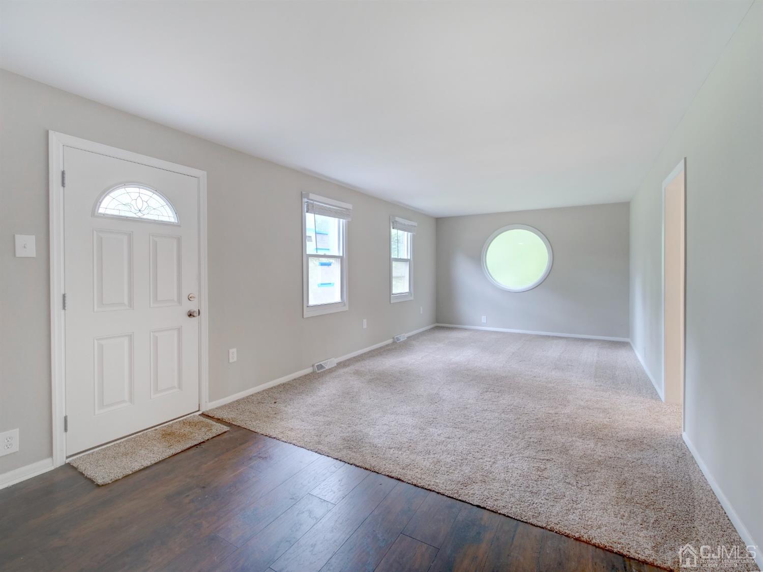 80 Pleasant Valley Road Old Bridge, NJ 08857 - Photo 2 of 15 a view of a room with wooden floor and window