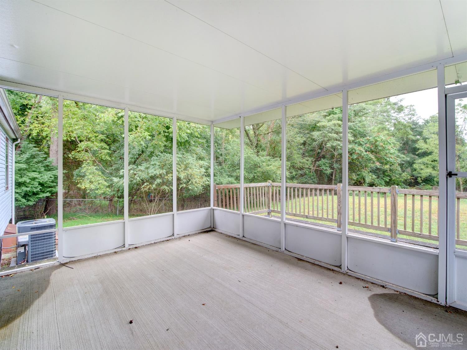 80 Pleasant Valley Road Old Bridge, NJ 08857 - Photo 14 of 15 a view of a room with sliding glass door and mountain view