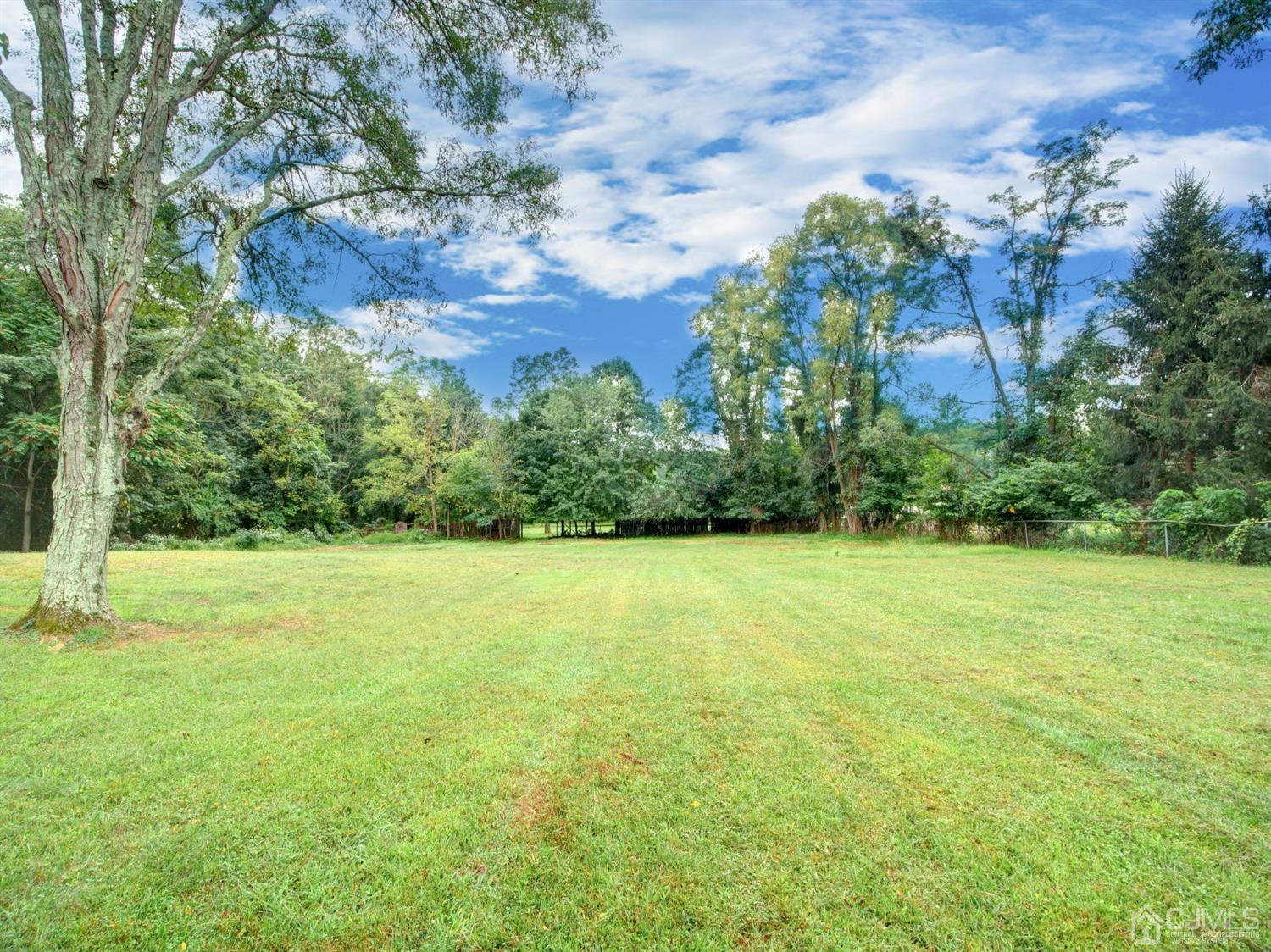 80 Pleasant Valley Road Old Bridge, NJ 08857 - Photo 15 of 15 a view of a field with an trees