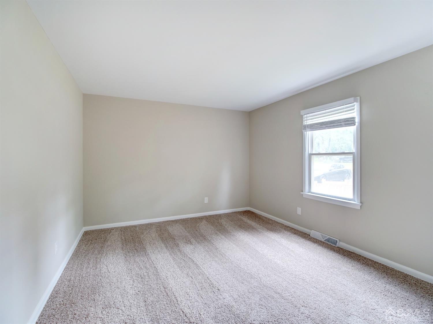 80 Pleasant Valley Road Old Bridge, NJ 08857 - Photo 6 of 15 an empty room with a window