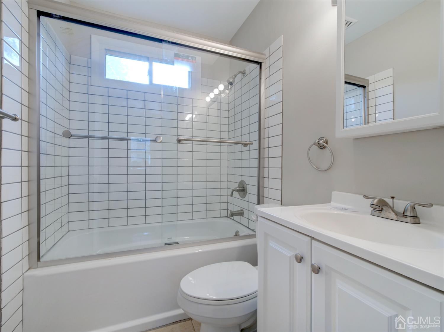 80 Pleasant Valley Road Old Bridge, NJ 08857 - Photo 7 of 15 a bathroom with a bathtub shower sink vanity and toilet