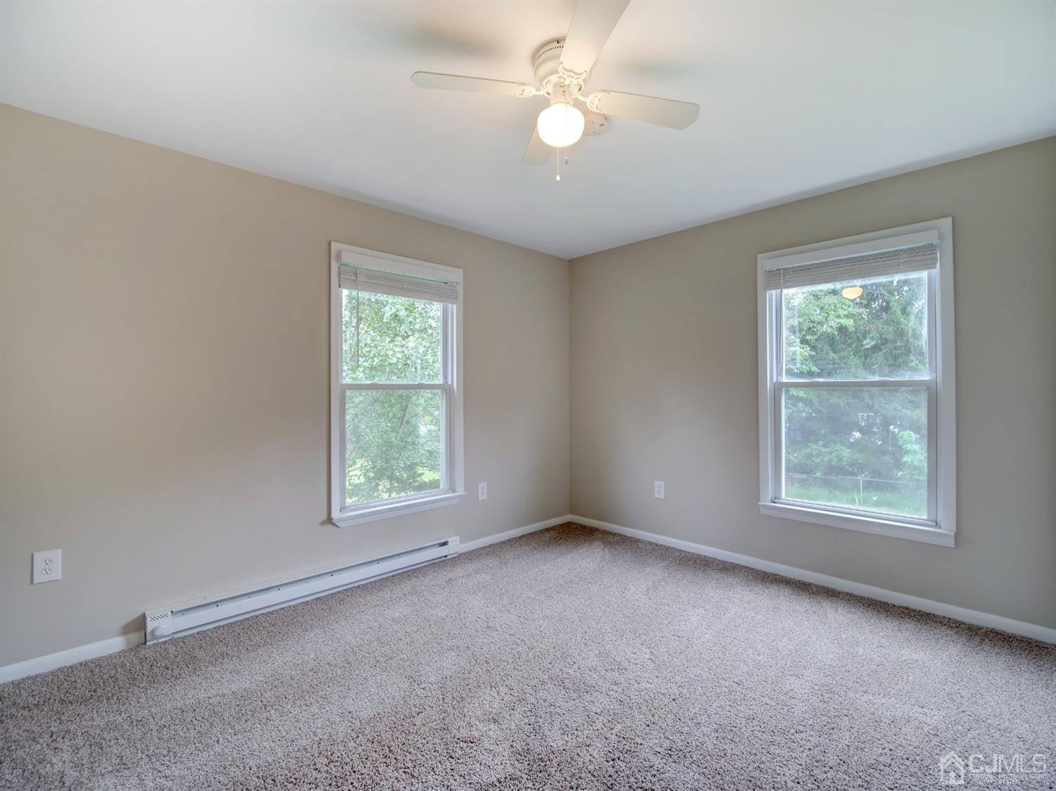 80 Pleasant Valley Road Old Bridge, NJ 08857 - Photo 8 of 15 a view of an empty room with a window