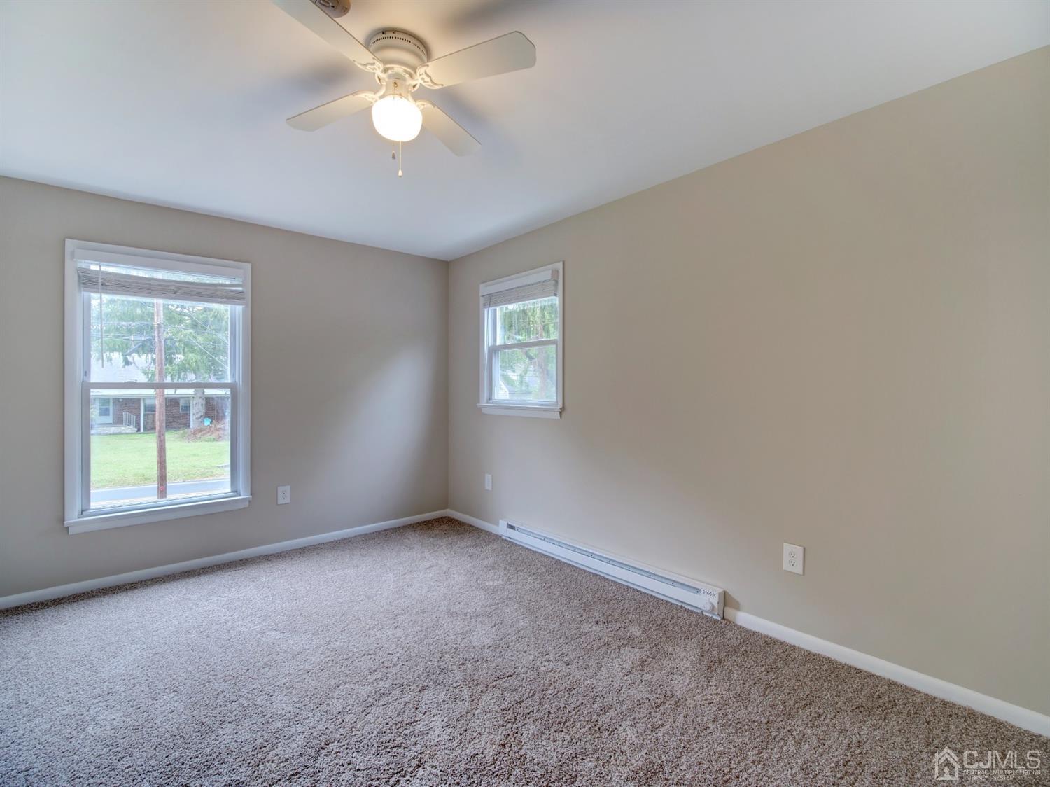 80 Pleasant Valley Road Old Bridge, NJ 08857 - Photo 10 of 15 a view of an empty room with a window
