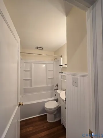 a bathroom with a toilet a sink and a shower